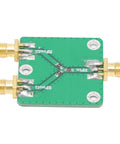 Real Deal Two Way RF Power Splitter Module And Signal Dividing PCB Board Offering Six Decibel Attenuation With Straight Up Reliable DC To Five Gigahertz Operation Period, featuring SMA ports and green double-sided PCB.