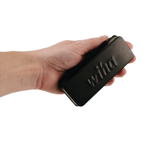 Close-up of hand holding the compact 35 Piece Bit Ratchet Storage Box Set With Slotted And Phillips Bits Square Torx And Hex.