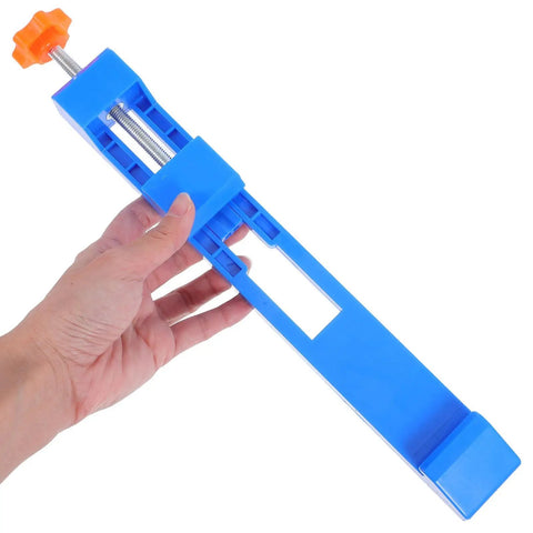 Grab These 2pcs Adjustable Wood Cutting Positioning Clamps For Your Circular Saw Rail, blue clamp held in hand for precise cutting.