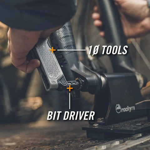 Person using Lockdown Driver 7 In 1 EDC Multitool With A 2.5 Inch Plain Edge Blade, Scissors, Bit Driver, File, Chisel, Awl on a bike
