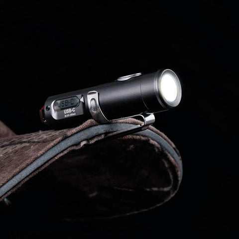 Gen 4 Mini Keychain Flashlight Ultra Bright 650 Lumens USB C Rechargeable EDC Light Water Resistant Pocket Sized For Everyday Carry Camping And Emergency Situations on a fabric surface
