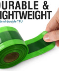 Hand holding green TPU bike tire liner, durable and lightweight for 24 to 29 inch mountain and road tires.