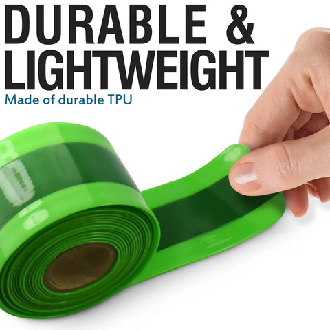 Hand holding green TPU bike tire liner, durable and lightweight for 24 to 29 inch mountain and road tires.