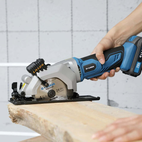 Side view of blue G LAXIA cordless mini circular saw with laser guide cutting wood; includes 24T and 60T blades