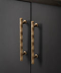 Champagne Bronze Cabinet Pulls 5 Inch Hole Center 10 Pack No Brainer Durable Hammered Sleek Handles installed on cabinet
