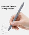 Pack Of Six Smooth Writing Retractable Gel Pens Featuring Snappy Click Mechanism And Fast Drying Black Ink That Rolls Dead Smooth Across Pages Ideal For Classroom Assignments Desk Organization And Daily Note Taking Without Any Smudging, held in hand for smooth writing.