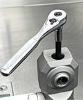 Universal Inverted Fork Service Tool Kit With Spring Compressor tool in use on metal surface