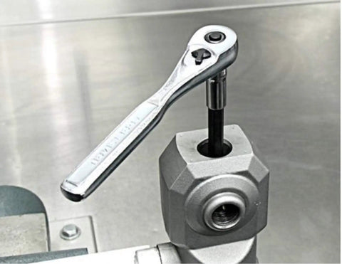 Universal Inverted Fork Service Tool Kit With Spring Compressor tool in use on metal surface