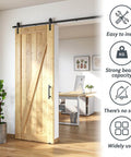 Lite Version Black 6.6 Foot Barn Door Hardware Kit With Sliding Track System installed on a wooden door in a modern home office