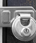 Diskus Solid Body Storage Padlock 80mm Wide For Lock It Down Storage And Transport With 2 Keys Keyed Alike mounted on gate