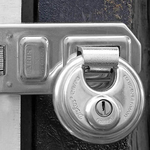 Diskus Solid Body Storage Padlock 80mm Wide For Lock It Down Storage And Transport With 2 Keys Keyed Alike mounted on gate