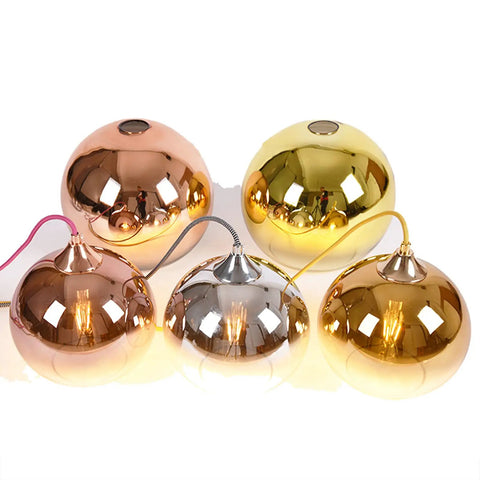 Gradient Gold Glass Globe Pendant Light For Kitchen Island Dope Glow Sphere Fixture in metallic finishes, illuminated.