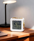 Total Game Changer Farmhouse Sunflower Butterfly Digital Cube Clock With Led Time Date Temp Readout on wooden desk.