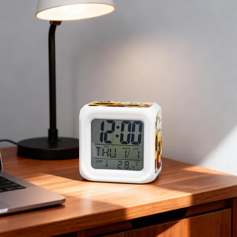 Total Game Changer Farmhouse Sunflower Butterfly Digital Cube Clock With Led Time Date Temp Readout on wooden desk.