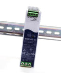 Heavy Duty Industrial Din Rail Power Supply 60 Watt 24 Volt 2.5 Amp shown mounted on a DIN rail for easy installation.