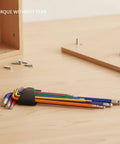 Durable S2 Alloy Steel Hex Key Set With Multicolor Allen Wrenches For Furniture Assembly And Mechanical Repair Tasks That Never Slip Or Bend The Best 9-Piece Kit You Need To Get Stuff Done Fast. 9-piece color coded S2 steel hex key set on wood surface
