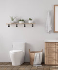 Bathroom setting with 6 Pack Industrial Pipe Shelving Brackets For Wall Mounts Vintage Black Iron Rustic Finish Built Tough Heavy Duty DIY Shelves holding plants.