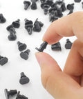 Hand holding 150 Pieces One Quarter Inch Drip Irrigation End Cap Plugs Barbed Tubing Fittings Kit for hoses