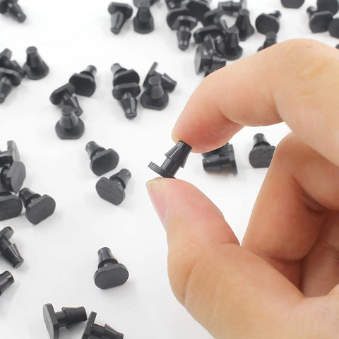 Hand holding 150 Pieces One Quarter Inch Drip Irrigation End Cap Plugs Barbed Tubing Fittings Kit for hoses