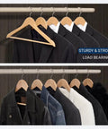 Straight Up Premium Quality Natural Wooden Coat Hangers Thirty Pack Flat Profile Wood Suit Hangers with jackets hanging in closet.