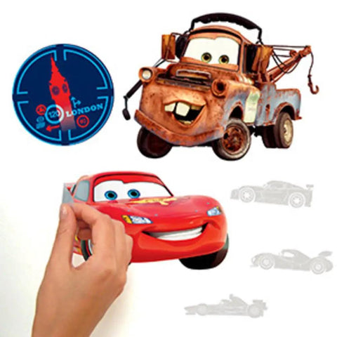 Hand applying Disney Pixar Cars 2 peel and stick wall decals vinyl for smooth surfaces removable and repositionable no sticky residue