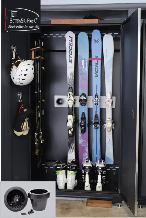 Badass Five Pack Ski Wall Hangers Securely Grip Every Alpine Board From Rockers To Racers And Kids Patented Design Saves Tip Wear While Keeping Your Garage Storage Dead Slick, mounted in a black cabinet.