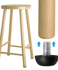 25 Pack Adjustable M8 Furniture Leg Levelers Featuring Durable Stainless Steel Bodies And Cushioned Nylon Bases To Kick Wobbly Tables Chairs Flat Plus Fast Screw Installation For A Rock Solid Scratch Free Finish Today with a wooden stool.