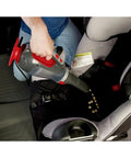 Using Dustbuster 12V Car Handheld Vacuum with Extra Long Nozzle to clean crumbs between car seats.