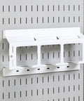 White pegboard drill holder storage rack for wall control pegboard compatible holds up to three drills or power tools and three spares.