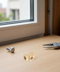 Brass Tee Fitting With Female Thread For Pneumatic Air Hose Connectors on a desk with tools