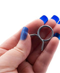 Hand holding a metal coil from Front Load Washer Water Valve Replacement Kit With Three Coils And Extension Hoses For 120V 60Hz DIY Ready