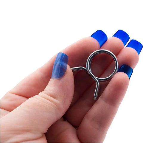 Hand holding a metal coil from Front Load Washer Water Valve Replacement Kit With Three Coils And Extension Hoses For 120V 60Hz DIY Ready