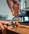 51mm Espresso Tamper Set With 30 Lb Consistent Pressure, Spring Loaded Calibrated Tamper in use on portafilter at home espresso machine