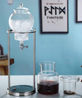 Premium Cold Brew Drip Tower With Adjustable Flow Control Borosilicate Glass Carafe And Heavy Duty Stainless Steel 600Ml setup with ice and brewed coffee.