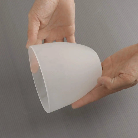 Hands holding a Bell Shaped Frosted Glass Shade For Ceiling Fans And Pendant Lights Replacement Lipless Glass Cover.