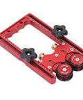 Bulletproof Table Saw Feeder Roller With 160 Millimeter Anodized Aluminum Housing Dual Bearing Assembly Kickass Wide Rubber Tires For Smooth Slip Free Stock Feed Runs on a red metal frame with adjustable rollers.