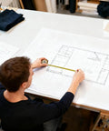 Graduation Gift Tape Measure Tool For Engineers And STEM Lovers 25 Foot Pocket Sized Measuring Tape in use on blueprint