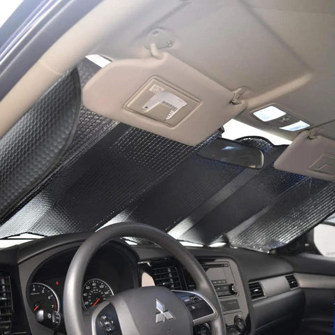 Thermal blocking auto sunshade installed in car interior, enhancing comfort for Level Up Your Slick Ride With This Premium Car Accessory Gift Bundle Featuring Thermal Blocking Auto Sunshade Two Tone Carpet Floor Mats And Ergonomic Grip Steering Wheel Cover For Trucks Vans SUVs.