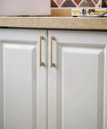Champagne Bronze Zinc Alloy Cabinet Handles 5 Inch Center To Center 128mm installed on kitchen cabinets.