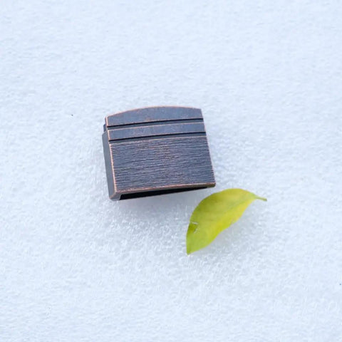 New Dope Habaki Collar Alloy Or Copper 01 22 Fit Katana Wakizashi Tanto beside a leaf on white surface