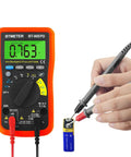 Hands using Bluetooth Enabled Digital Multimeter With App Logging And Auto Ranging, 4000 Count Multimeter For AC DC Voltage, Current, Resistance And Temperature, Data Export To Excel Or TXT On Phone, Dope Tool For DIY Techies measuring battery voltage.