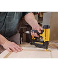 Person using 23 Gauge Pin Nailer 2 Inch Pneumatic Pinner With Tool Free Jam Release And Depth Adjustment Oil Free Operation on wood