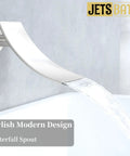 Close-up of brushed nickel waterfall tub spout from All-In-One Tub And Shower Faucet Set with water flowing into bath