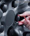 Hand using a dismantle tool to install Tesla Wheel Lug Nut Covers Kit For Model 3 Y S X, showing easy installation.