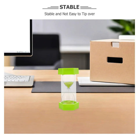 2 Minute Mini Hexagon Sand Timer In Grass Green on office desk, stable and handy for quick time checks and task reminders.