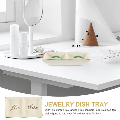 Slick Ceramic Jewelry Tray Featuring A Double Grid Ring Holder And Classy Gold Trim Trinket Dish For Your Nightstand Vibe And Staple Small Daily Organizer with rings on a desk.