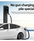Heavy Duty Type 2 Electric Vehicle Charger Extension Cable With Smart Temp Sensor And Automatic Leakage Cutoff Spring Flex Coil Cord Up To Twenty Two Kilowatts charging a car at a station.