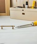Vintage Zinc Alloy Cabinet Pulls And Drawer Handles Two Pack Solid Metal Retro Heavy Duty Door Hardware For Kitchen Wardrobe And Shoe Cabinets With 96mm Hole Spacing Durable Easy Grip next to tools on a workbench.