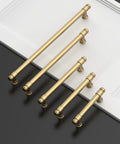 Five champagne bronze cabinet pulls displayed on a white surface, part of the Champagne Bronze Cabinet Pulls 3 Inch 76mm Set Of 10 Kitchen