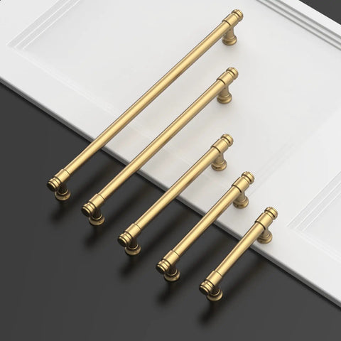 Five champagne bronze cabinet pulls displayed on a white surface, part of the Champagne Bronze Cabinet Pulls 3 Inch 76mm Set Of 10 Kitchen
